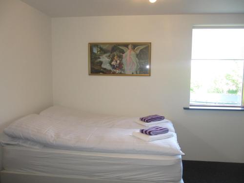 Ártún Apartmentにあるベッド