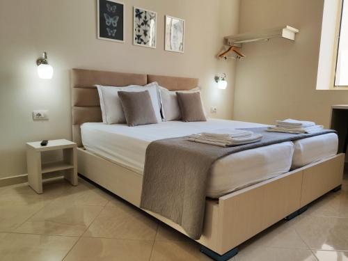a bedroom with a large bed in a room at Olive B&B in Berat