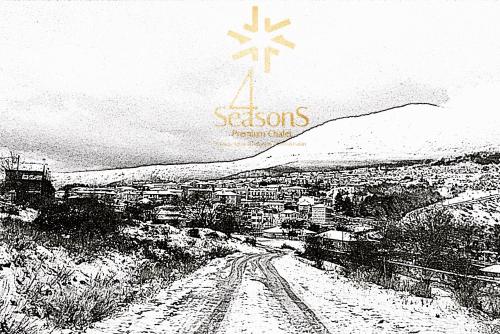a black and white photo of a city with a cross at 4 Seasons Premium Chalet & Massage Treatments in Palaios Agios Athanasios