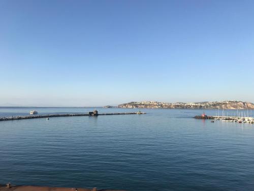 a large body of water with a pier in it at Vento di mare in Procida