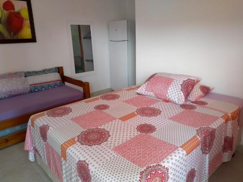 Ένα ή περισσότερα κρεβάτια σε δωμάτιο στο Residencial Villa Nova SUITE