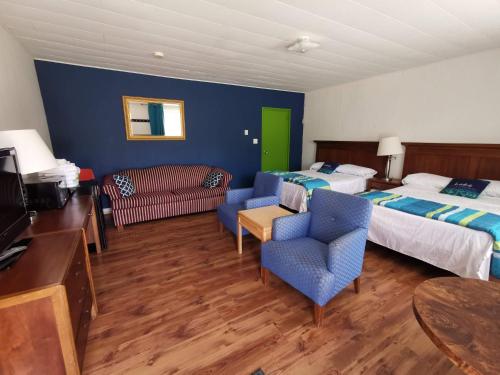 Ένα ή περισσότερα κρεβάτια σε δωμάτιο στο All Tucked Inn