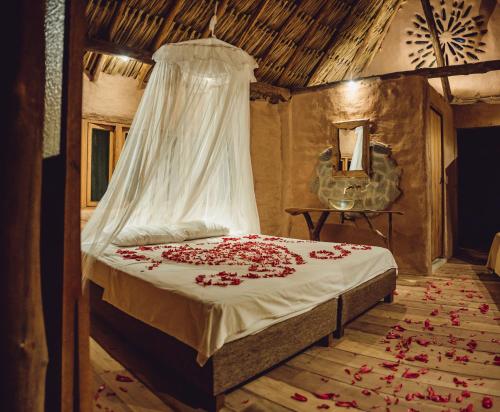 Postel nebo postele na pokoji v ubytování Ecolodge Cosmogénesis