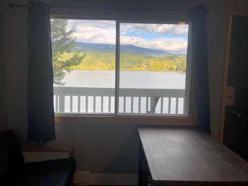 a window in a room with a view of a lake at Jasper Way Inn Resort & Campground in Clearwater