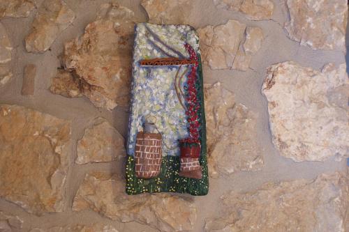 a small figurine of a train on a rock at Apartamentos Rurales El Tio Pablo Picos de Europa Tresviso in Tresviso