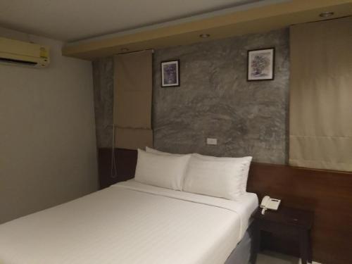 Postel nebo postele na pokoji v ubytování Sunset Beach Villas