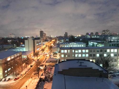 a view of a city at night with at My SmartApart Hotel Today in Kyiv