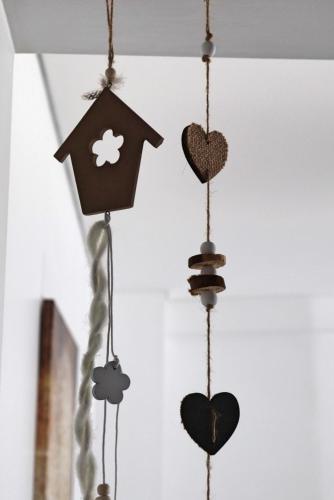 a group of hearts hanging from a ceiling with birdhouses at Castle in Blue Apartments-Sea View in Sines