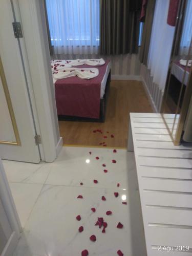 a room with a bed with roses on the floor at Burj Al Istanbul in Istanbul