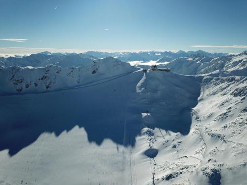 an aerial view of a snow covered mountain at Glacier Hotel Grawand in Maso Corto
