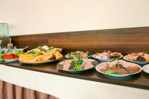 a buffet line with many different types of food at OW Mikomania in Charzykowy