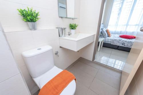 a bathroom with a toilet and a sink and a mirror at PV21 Setapak Wangsamaju Melawati 15 min to KLCC- 2ROOM in Kuala Lumpur