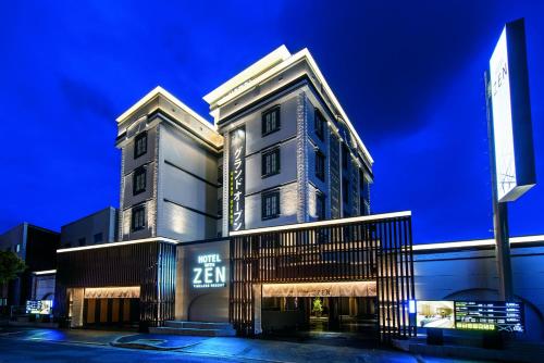 a tall building with a sign on the side of it at HOTEL ZEN HIRANO (Adult Only) in Osaka