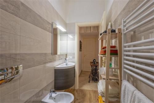 a bathroom with a sink and a toilet in it at Casa di Marina in Viareggio