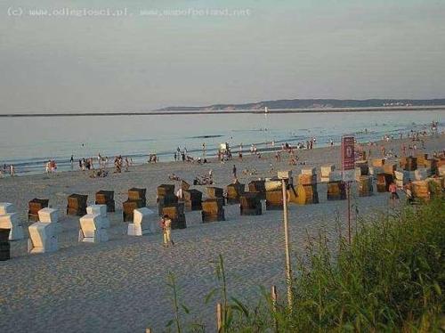 a beach with a lot of people and the ocean at Swinoujscie Poland Luxury Penthouse Sleeps 9 in Świnoujście
