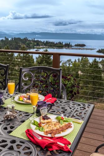 a table with two plates of food and glasses of orange juice at Outlook Inn Bed and Breakfast in Somers