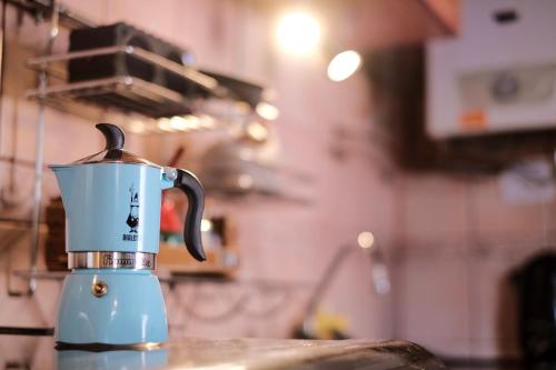 a coffee cup is sitting on a counter at Leónidas Design Loft in Mendoza