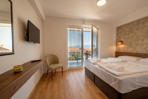 Postel nebo postele na pokoji v ubytování Apartments Bashoski