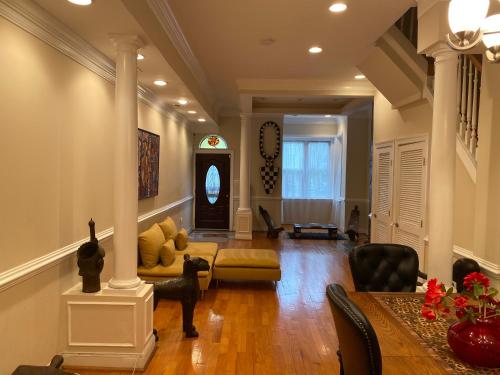 a living room with a couch and a table at Bloomingdale Beauty near Union Station in Washington, D.C.