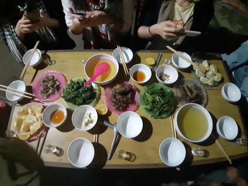 a table with a bunch of food on it at Mu Cang Chai Center Homestay and Tours in Mù Cang Chải
