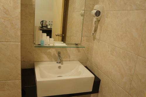 Koupelna v ubytování LABUAN JATI HOTEL