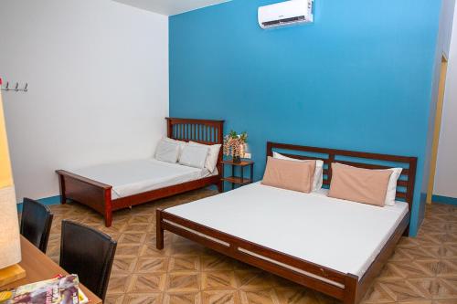 Postel nebo postele na pokoji v ubytování Mayas Guesthouse