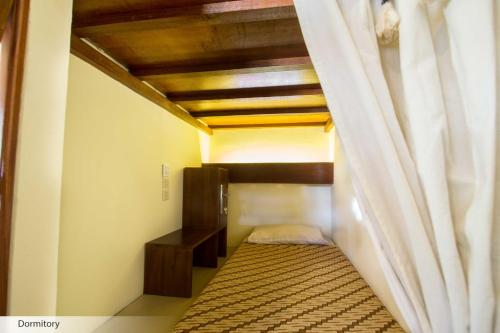 Кровать или кровати в номере Duta Guest House
