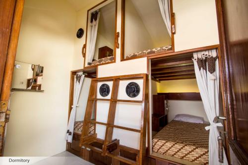 Кровать или кровати в номере Duta Guest House