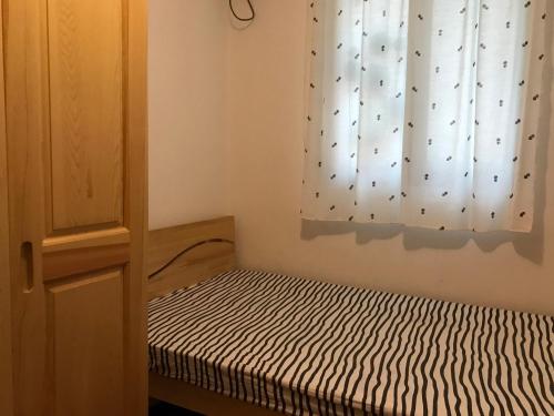 Postel nebo postele na pokoji v ubytování Lin Jiang Apartment
