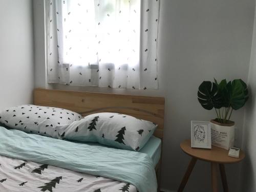 Postel nebo postele na pokoji v ubytování Lin Jiang Apartment