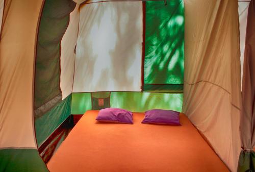 Un pat sau paturi într-o cameră la Camping Nopigia