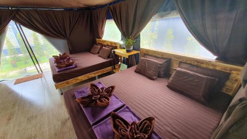 Postel nebo postele na pokoji v ubytování Moonshine Resort Chumphon