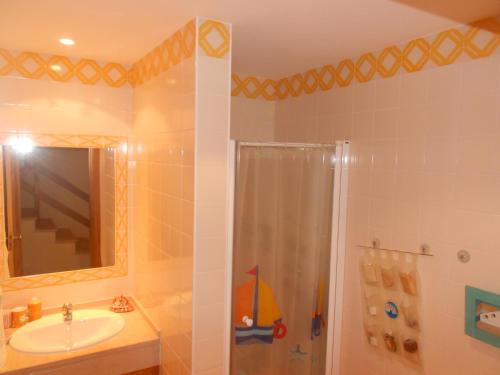 a bathroom with a shower and a sink at Algarve Praia Verde in Altura