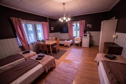 Krevet ili kreveti u jedinici u objektu Arctic Guesthouse & Igloos