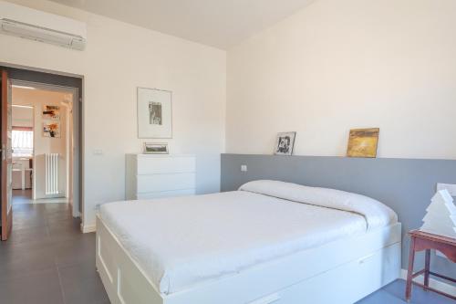 מיטה או מיטות בחדר ב-Ferrara Be My Guest