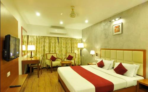 Hotel Adityaにあるベッド