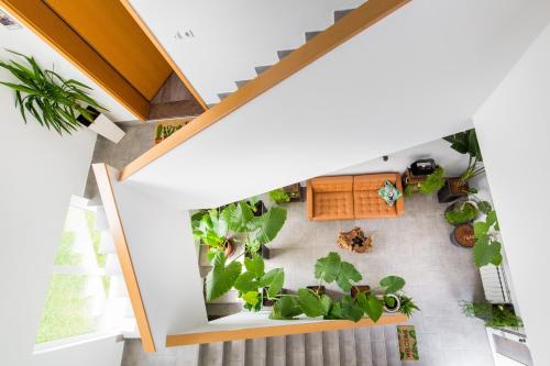 an overhead view of a house with plants on the floor at Tara Garden in Velika Gorica