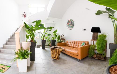 a living room filled with lots of plants at Tara Garden in Velika Gorica