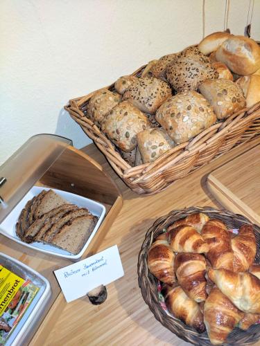 a bunch of breads and pastries on a table at Haus am Grasberg in Poppenhausen
