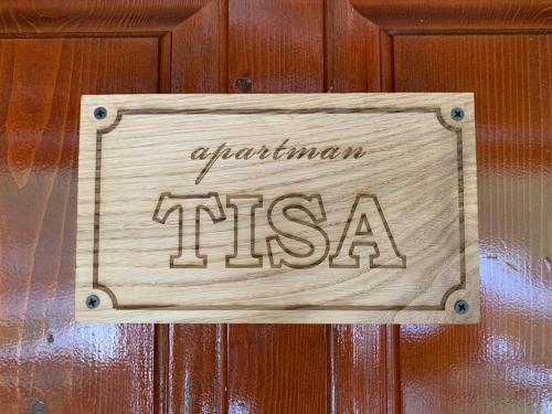 a wooden sign on a wooden door with the word organism msemia at Mountain house Vilina rosa in Kolašin