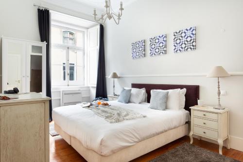 Postel nebo postele na pokoji v ubytování JOIVY Downtown City Apartments