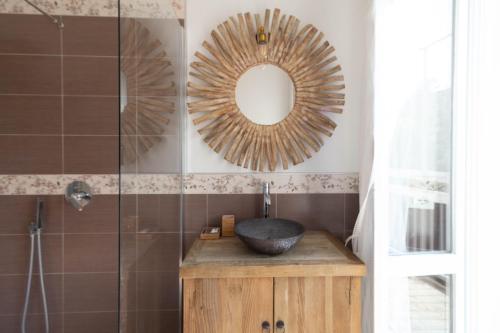 a bathroom with a sink and a mirror at Le Casette Di Osvaldo in Lecco