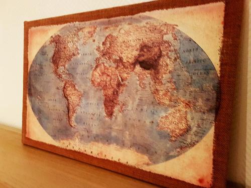 a map of the world in a wooden frame at SW Cosy Apart - Chambly Persan Roissy in Persan