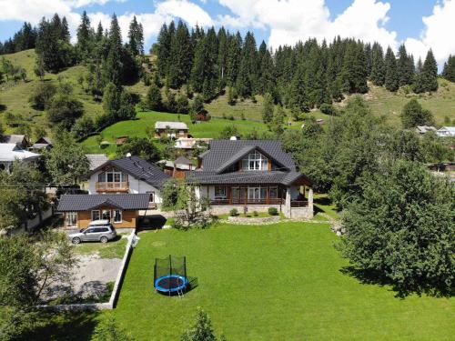 an aerial view of a house with a large yard at Cottage Familiya in Verkhovyna