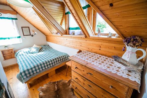 a small room with a bed and a window at Authentic Countryside Villa with Hot tub in Veliki Kamen