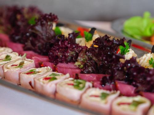 a platter of food on a table at Rezydencja Eger in Kazimierz Dolny