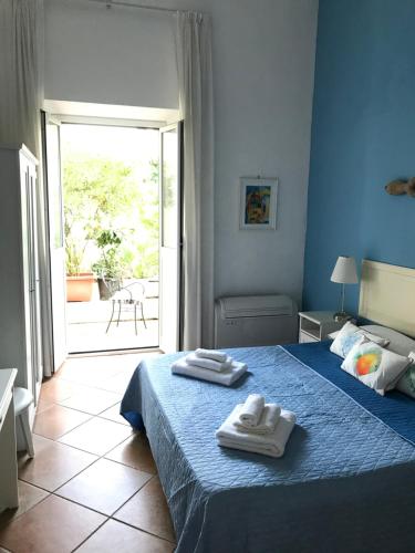 Una cama o camas en una habitación de Il Miraggio