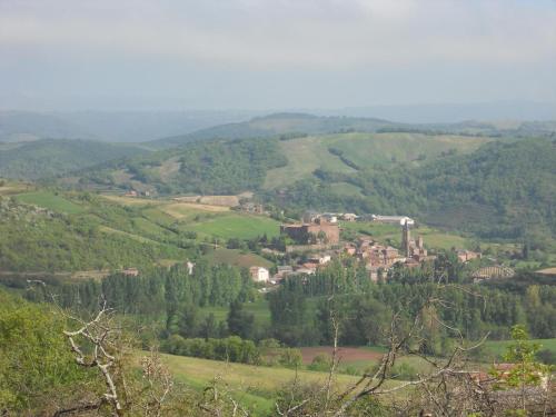 a small town in the middle of a green valley at Gîte des Monts in Saint-Izaire
