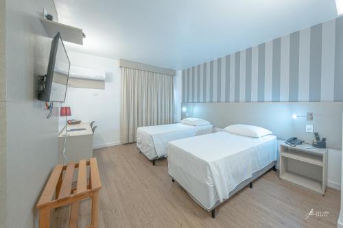 Ένα ή περισσότερα κρεβάτια σε δωμάτιο στο Antonio´s Palace Hotel