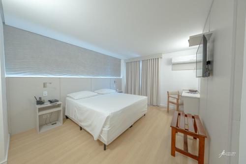 Ένα ή περισσότερα κρεβάτια σε δωμάτιο στο Antonio´s Palace Hotel